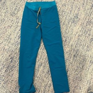 Barely worn figs Livingston. Teal. Size small